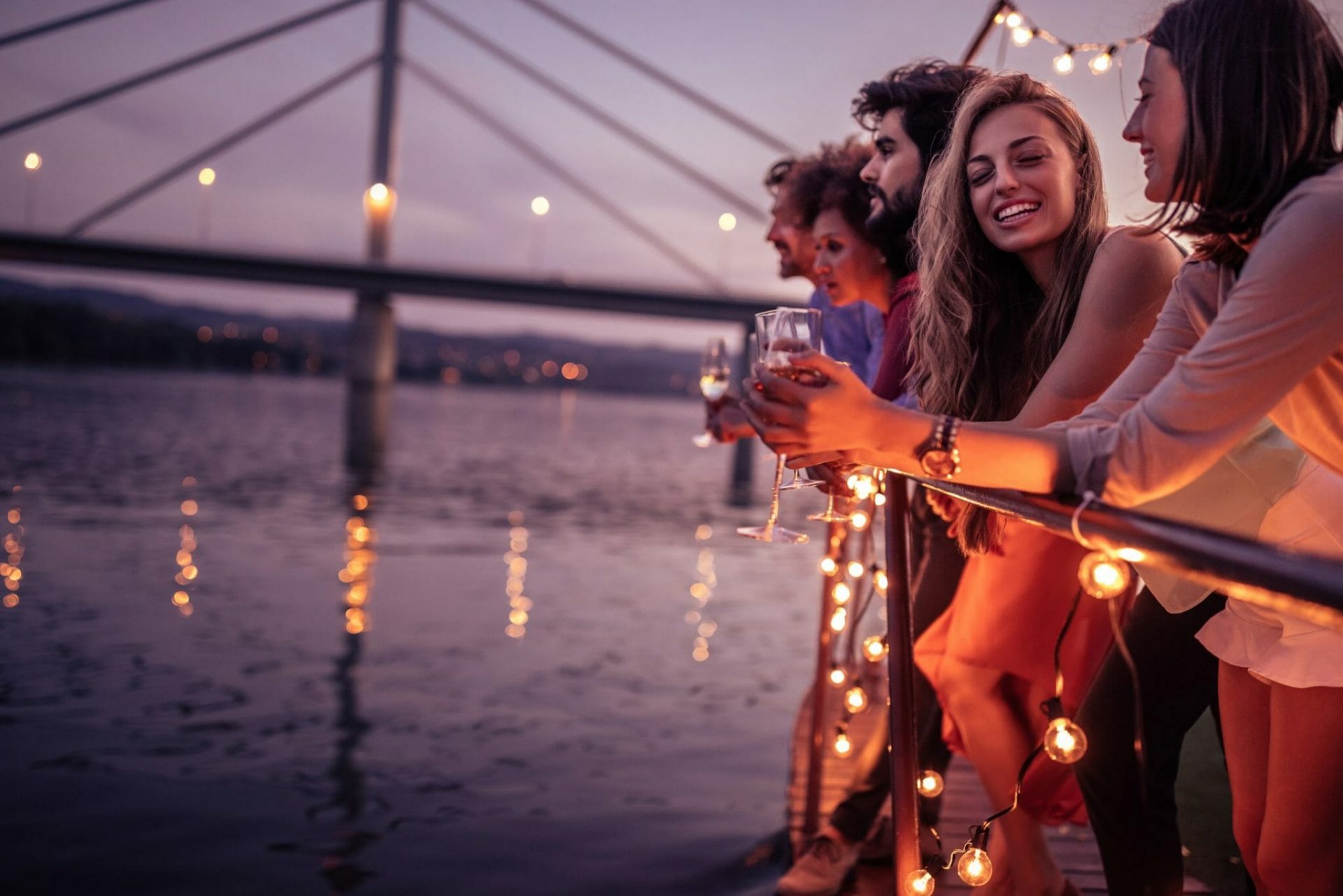 Group,Of,Friends,Relaxing,On,A,Boat,Cruise
